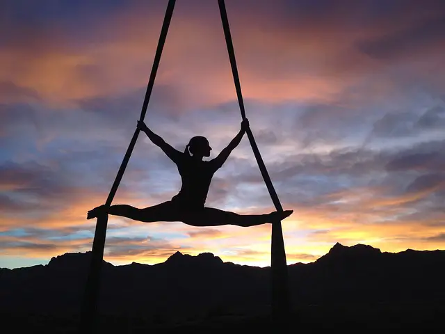 silhouette of a woman performing gymnastics